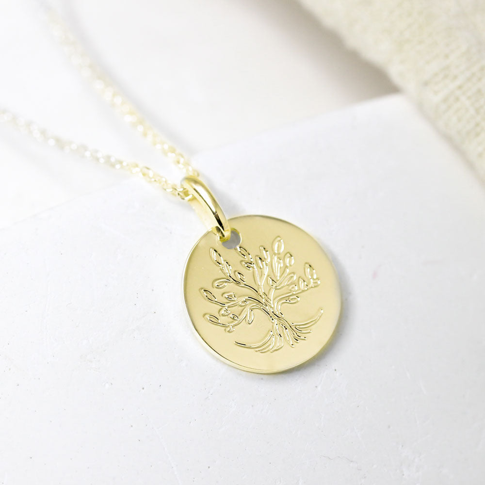 Médaille en or jaune joaillerie artisanale Paris et Lyon.